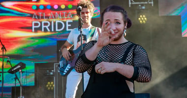 Interpreter using sign language for deaf participants at Atlanta Pride