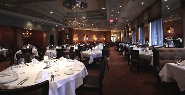 Interior photo of the dining room at a Ruths Chris Steak House location.