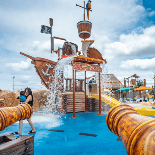 An image of the accessible pirate ship themed splash pad at Morgan's Inspiration Island.