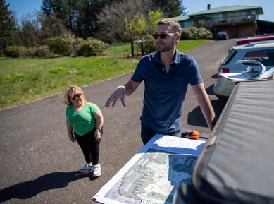 Meyer/Reed principal landscape architect Jeramie Shane, right, talks about designs for a new Cape Horn lookout while senior designer Margaret Drew, left, listens. Friends of Columbia River Gorge is working with Mayer/Reed to design the lookout and outdoor area with accessibility at the forefront.