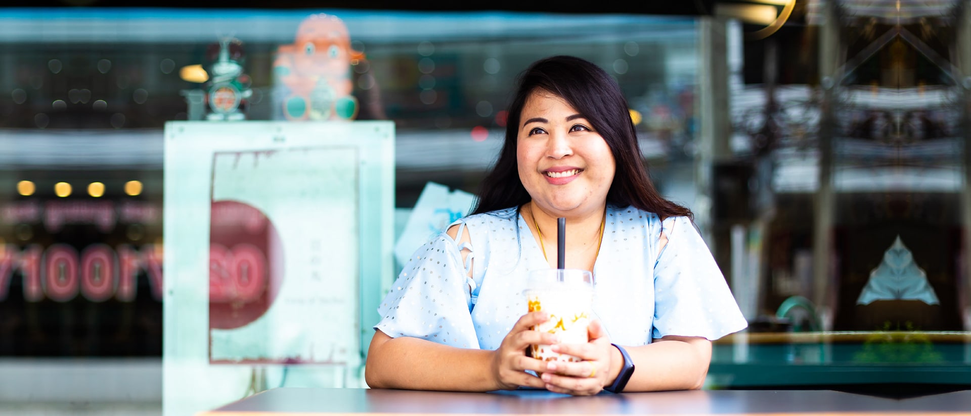 Woman smiling at a cafe