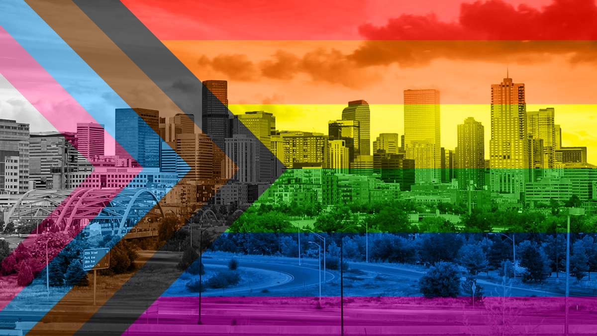 Disability Pride Flat superimposed over the Denver skyline.